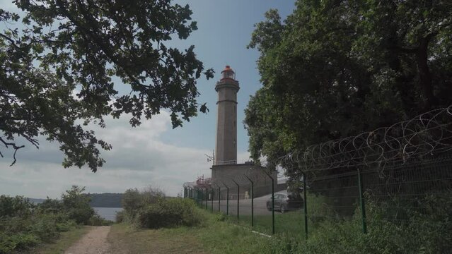 Phare Du Portzic lighthouse and the rocky shore of the ocean in the French city of Brest. View of the Phare du petit minou in Plouzane, Brittany, France. Portic Lighthouse. 