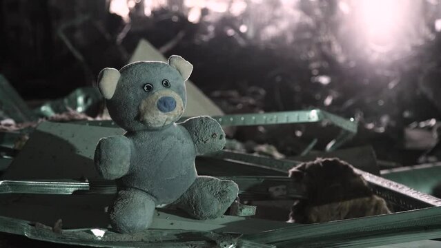 Terror attack bomb shell civilian bombed building destroy city war concept explosion. 2022 Russian invasion of Ukraine war child teddy bear toy building ruins city destruction building damage war torn