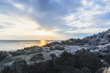 sunset over the sea rocks HDR