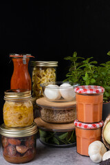 Elegant batch cooking scene with several glass containers piled full of homemade food.