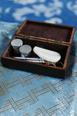 Accessories for the baptism of a child in the church. Cross. holy light. Box with essential oils. Holy water. Evangelia.