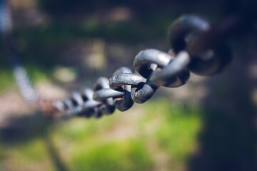 Stainless metal safety chain closeup.