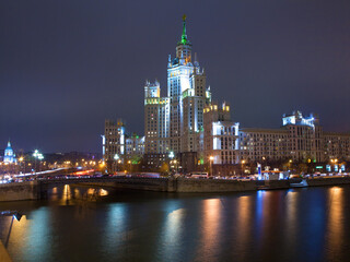 Fototapeta na wymiar Evening picture of high building on river. Moscow, Russia