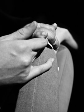 Sarah Johnson holds camper's hand