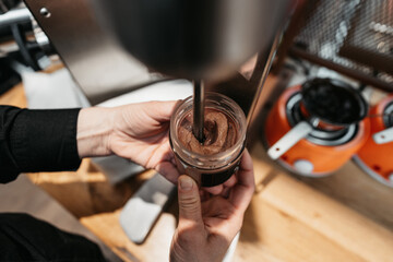 Making of delicious cream from freshly roasted nuts and seeds. Vegan and vegetarian food concept.