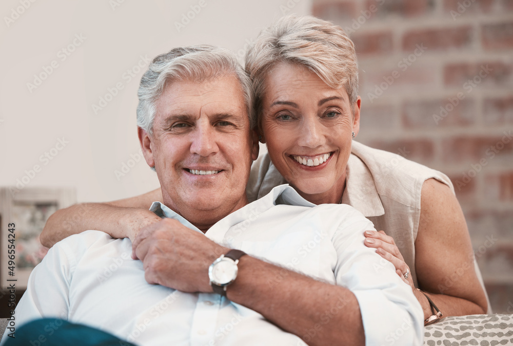 Poster a lifetime of bonding. portrait of an affection mature couple posing for a picture on the sofa toget