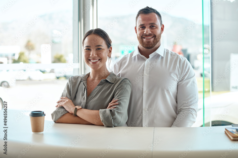 Wall mural This is the dream team. Shot of a customer with her car salesman in the dealership.