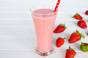 Strawberry yogurt fruit juice smoothie pink colorful fruit juice milkshake blend beverage healthy high protein the taste yummy In glass drink episode morning on white wood background.