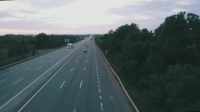 The E95 highway will connect the city of Odessa and the city of Kyiv in Ukraine. There are cars on the road in both directions.