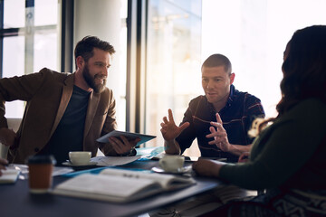 We have to think longterm. Shot of a group of motivated business people having a meeting and...