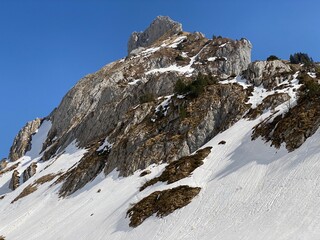 Rocky peak Dejenstogg or Dejenstock (2022 m) in the Glarus Alps mountain range, over the Kl&ouml;ntalersee (or Kloentalersee) reservoir lake and Kl&ouml;ntal alpine valley - Canton of Glarus, Switzerland