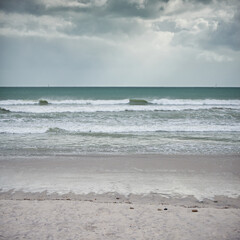 Quiet overcast morning. Landscape shot of a beach on a cloudy day.