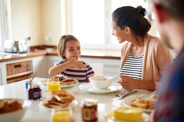 Having fun at the breakfast table. Shot of a family having breakfast together.