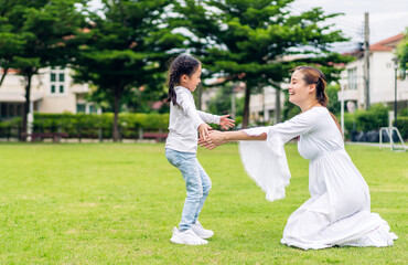 Portrait of enjoy happy love asian family mother and little asian girls child smiling and having fun hug with cute kid daughter moments good time