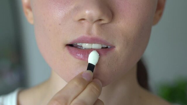 Girl Applying Hygienic Lipstick (close Up Shot)