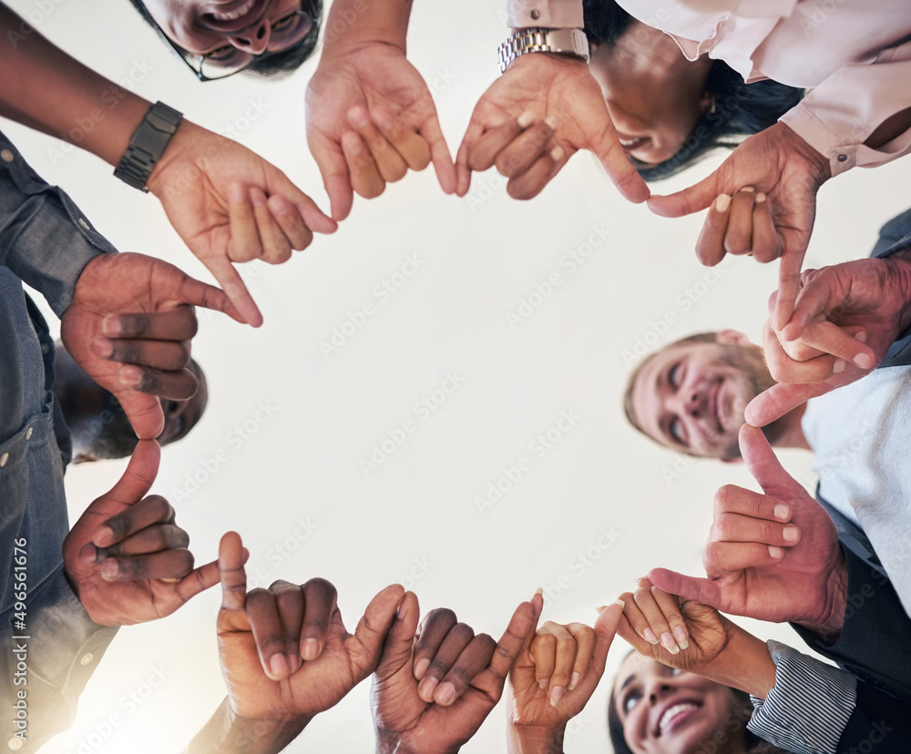 Aufkleber theyre in the creative circle. low angle shot of a team of creative colleagues making a circle with 