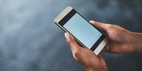 The best app for fitness fanatics. Cropped shot of a woman using a smartphone in a gym.