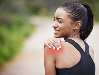 This muscle feels so tight. Shot of a sporty young woman experiencing shoulder pain while...