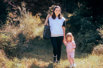 Mother and Child Walking Outdoors in Nature During Summer Vacation