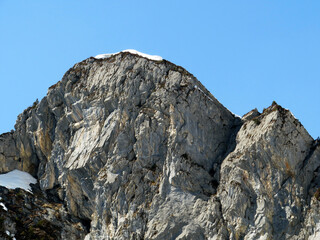 Rocky peak Mättlistock (Maettlistock or Mattlistock, 1911 m) in the Glarus Alps mountain range, over the Klöntalersee reservoir lake and Klöntal alpine valley - Canton of Glarus, Switzerland (Schweiz)
