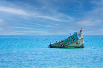 Beautiful view of old shipwreck in the middle of Chonburi sea with sky and background. Tropical,...