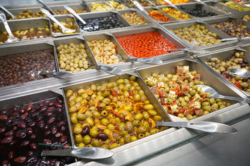 variety of colorful fresh olive and vegetable salad in restaurant