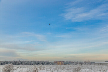air ambulance helicopter flies to the call on a frosty winter evening