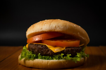 Fresh hamburger on black background
