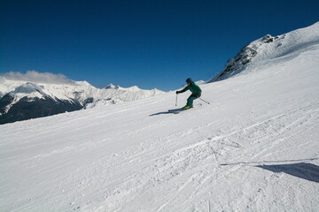 Fototapeta na wymiar A skier on the slopes of a ski resort, Sochi, Russia.