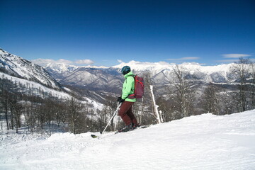 Fototapeta na wymiar A skier on the slopes of a ski resort, Sochi, Russia.