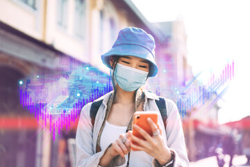 Young adult asian woman using mobile phone for online network metaverse wear face mask for vaccine...