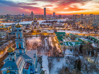 Winter Yekaterinburg, Temple of the Ascension and Temple on Blood in beautiful pink and orange sunset.