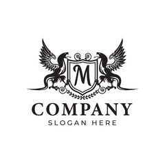 Two Winged Snakes. letter M. Antique Design. Creative Black Logo with Animal Silhouette Kingdom Character. Stylish Templates for Brand Names, Boutiques, Business Cards, Printing on Clothing.