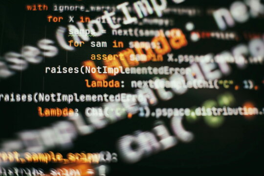 IT business. Python code computer screen. Mobile application design Concept.
