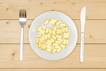 A handful of capsules with vitamin Omega 3 on a white plate, top view