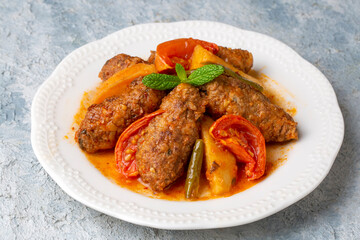 Traditional Homemade Turkish Food Kofte - Kofta with Tomato Sauce and Potatoes. (Turkish name;...