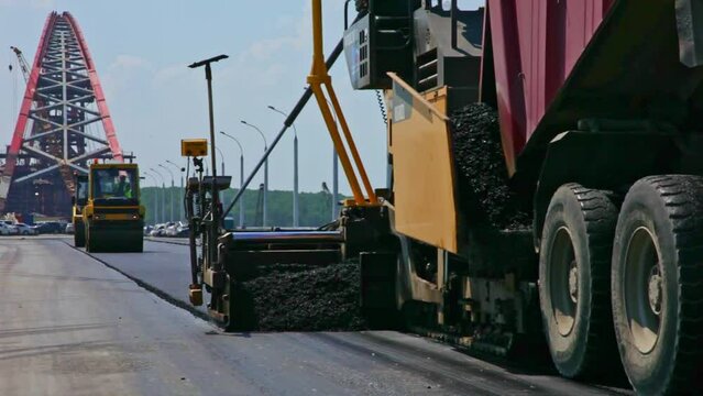 Heavy road construction equipment. Construction of an asphalt road.