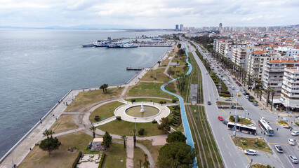Dolphin statue in a pond, Karsiyaka, Photographing from the sky with drone Izmir Bostanli view