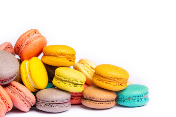 Colorful macaroon cakes. Small french muffins. Colorful macarons on a white background