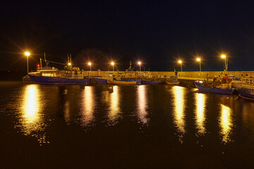 Fototapeta na wymiar Kuznica village, Poland, Puck Bay, view of the small fishing port at night 