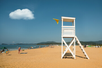 Lifeguard tower on the beach. Safe recreation on the beach. Tourist season. Viewing platform.
