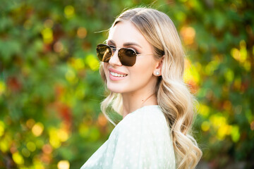 Spring romantic casual woman in sunglasses, portrait. Beautiful girl outdoor, close up beauty young...