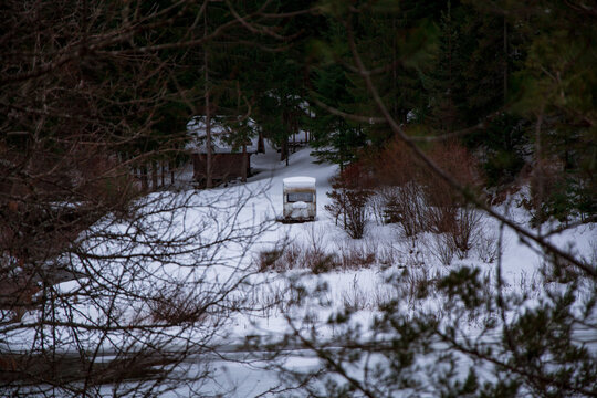 Camping trailer in forest at winter