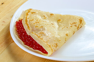Russian pancake with red caviar