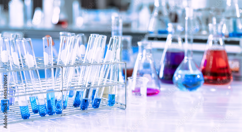 Wall mural glass flask in chemical science education laboratory with molecular structure in blue background