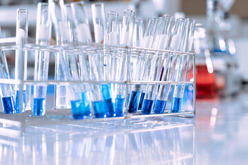 glass flask in chemical science education laboratory with molecular structure in blue background