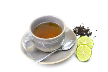 Bergamot tea or Earl Grey tea in ceramic cup and fresh bergamot fruit with sliced isolated on white background.