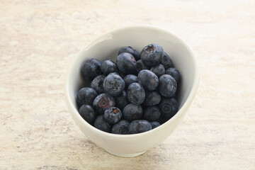 Sweet ripe blueberry heap in the bowl