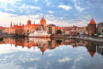 Motlawa river with the view of the medieval towers of the old city of Gdansk.