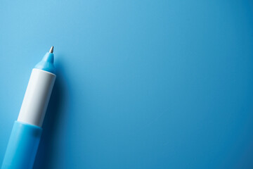 blue ball pen against blue background
